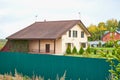 Village street with wooden house in summer day. Traditional old house in Russia Royalty Free Stock Photo