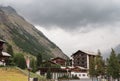 Village in Swiss Alps. Traditional wooden alpine houses. Sky before a thunderstorm. Royalty Free Stock Photo