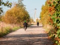 Village teen bikers race along a dusty country road Royalty Free Stock Photo