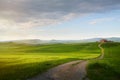 village in tuscany; Italy countryside landscape with Tuscany rolling hills ; sunset over the farm land and country road Royalty Free Stock Photo