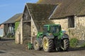 Village view old farm and new tractor Royalty Free Stock Photo