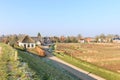 Village view Waardenburg with original village houses in polder landscape