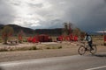 villager on a bicycle traveling on a road in front of a place of popular veneration in the Province of Jujuy