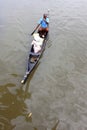 A Villager rows a traditional boat in the backwaters