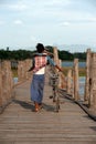 Villagers bike trailers on Uben bridge,Myanmar.