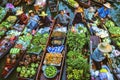 Villagers in boats in canal to sell products at floating market thailand