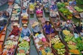 Villagers in boats in canal to sell products at floating market thailand