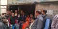 Villagers busy in a meeting in a small tea stall in morning .