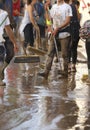Villagers cleaning after floodings in San Llorenc in the island Mallorca vertical