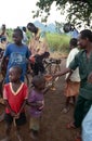 Villagers listening to pedal-powered radio, Uganda