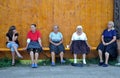 Villagers resting on a bench Royalty Free Stock Photo