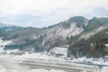 Villages of Shirakawago and Gokayama are one of Japan`s UNESCO World Heritage Sites. Farm house in the village and mountain behin Royalty Free Stock Photo