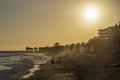 Villajoyosa beach at sunset with sun rays on the sand Royalty Free Stock Photo