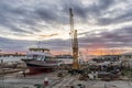 Villajoyosa port with a large boat out of the water at sunset Royalty Free Stock Photo