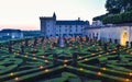 VILLANDRY CASTLE, FRANCE - JULY 07, 2017: The garden illuminated by 2,000 candles at dusk . Nights of a Thousand Lights at Royalty Free Stock Photo