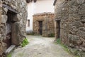 Old houses of traditional construction of granite stones and wooden beams in the arcade in the town of Villanueva de la Vera in