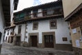 An old traditional house with granite stone door frame and wooden beams and balconies in the town of Villanueva de la Vera in Royalty Free Stock Photo