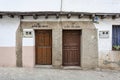 Two doors of neighboring houses built according to the inscription in the year 1845, example of the typical and traditional