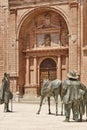 Villanueva de los Infantes square. Don Quijote and cathedral facade