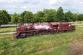 Villarcayo, Spain - June 10, 2020: Old train cemetery. Aerial view of an old abandoned rusty steam train.