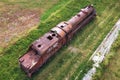 Villarcayo, Spain - June 10, 2020: Old train cemetery. Aerial view of an old abandoned rusty steam train.
