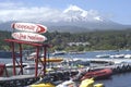 Villarrica, one of the most active volcanoes in Chile, seen from Pucon.with boat marina with luxurious architecture.may 2016