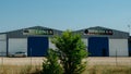 A sign outside a warehouse written melones and sandias meaning melons and watermelons