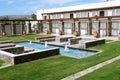 Villas with swimming-pool and fontains. Royalty Free Stock Photo