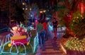 People looking at the Christmas decoration on the sidewalk of a house in Villavicencio