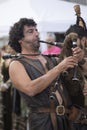 VILLAVICIOSA, SPAIN - 28 August 2018: Recreation of Charles V`s landing in Spain. A bagpiper on the map receives Charles I of