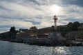 VILLEFRANCHE-SUR-MER, FRANCE- 12 MARCH, 2023: Small Lighthouse in the bay of Villefranche sur Mer Old Town on the French