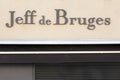 Jeff de Bruges logo on a wall