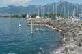 Villeneuve, VD / Switzerland - 31 May 2019: women prepare to leave Villeneuve harbor on Lake Geneva on a paddleboard excursion
