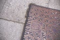 Vilnius city pavement textured iron hatch with emblem Royalty Free Stock Photo