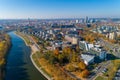 Vilnius Cityscape with Autumn Trees and Traffic. Lithuania