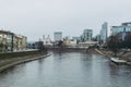 Vilnius cityscape with Vilnia river and skyscrapers on the background