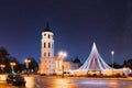 Vilnius, Lithuania. Amazing Bold Bright Blue Starry Sky Gradient Above Christmas Tree On Background. Bell Tower Belfry Royalty Free Stock Photo