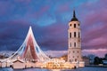 Vilnius, Lithuania. Amazing Magic Misty Cloud Colorful Sky Above Christmas Tree On Background. Bell Tower Belfry Of Royalty Free Stock Photo