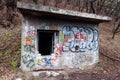 Entrance to abandoned concrete bunker built during the Second World War right in a hill near the center of Vilnius. Walls painted