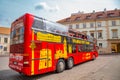 City tour sightseeing bus at Simonas Daukantas Square in Vilnius, Lithuania Royalty Free Stock Photo