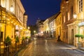 Vilnius Lithuania. Brightly Illuminated Pilies Street, Ancient Architecture, Deserted Outdoor Cafes