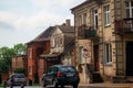 Vilnius, Lithuania - 11062020: Cars on road drive near old buildings on old town street