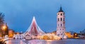 Vilnius, Lithuania. Christmas Tree On Background Bell Tower Belfry Of Vilnius Cathedral At Cathedral Square In Evening Royalty Free Stock Photo