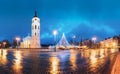 Vilnius, Lithuania. Christmas Tree On Background Bell Tower Belfry Of Vilnius Cathedral At Cathedral Square In Evening Royalty Free Stock Photo