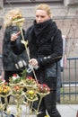 Blonde girl selling flower bouquets Royalty Free Stock Photo