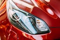 Vilnius Lithuania. Close Left Headlight Of New Red Kia Sportage