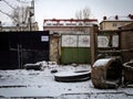 Vilnius, Lithuania - 04122021: The construction site on the old railway behind a fence with writing in lithuanian and