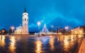 Vilnius, Lithuania. Christmas Tree On Background Bell Tower Belfry Of Vilnius Cathedral At Cathedral Square In Evening Royalty Free Stock Photo