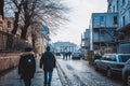 Vilnius, Lithuania - December 27, 2017: People walk along street