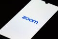 Zoom Video Communications app on the smartphone with finger Royalty Free Stock Photo